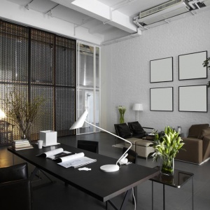 Modern minimalist office with desk and seating