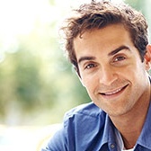 Smiling young man in blue shirt