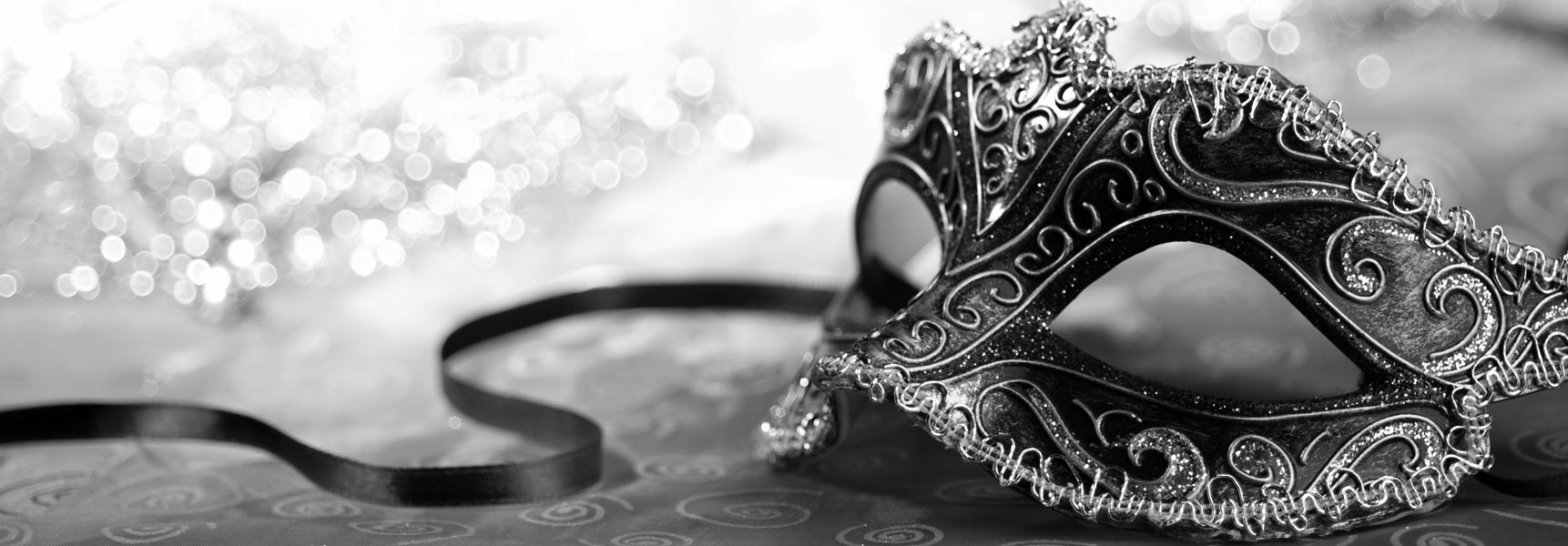 Ornate masquerade mask with ribbon