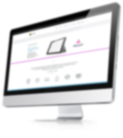 Desktop computer displaying blurred website on screen